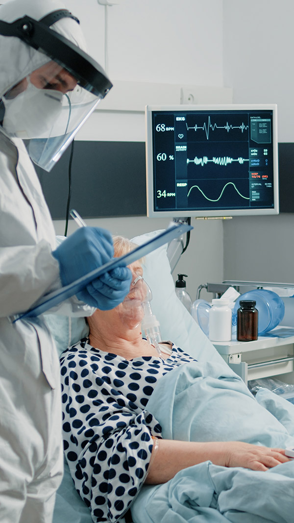 Patient with coronavirus talking to doctor in protective suit